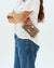 WOMAN HOLDING CONSUELA SLIM WALLET CALLED 